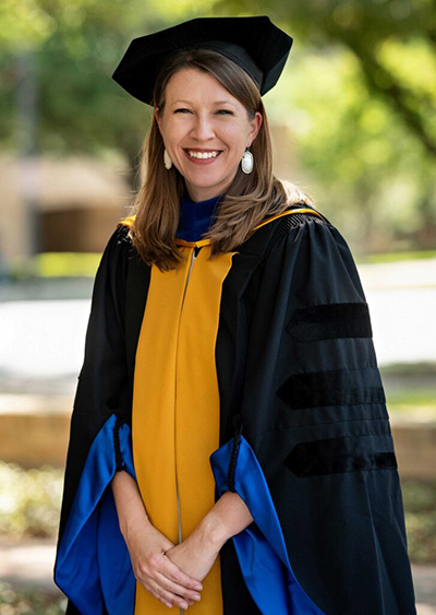 Emily Lund, dressed in full regalia